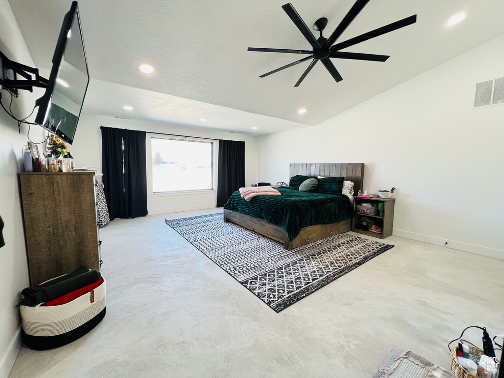 Bedroom featuring recessed lighting, visible vents, vaulted ceiling, concrete flooring, and baseboards