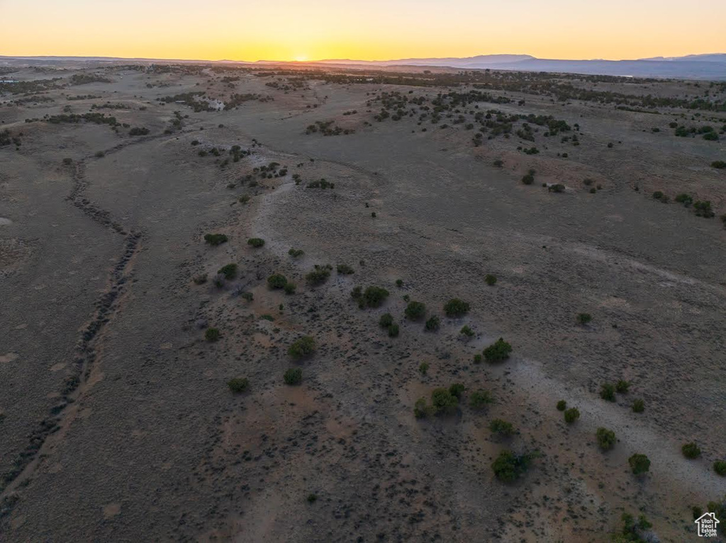 Aerial view at dusk with a rural view, a mountain view, and a desert view