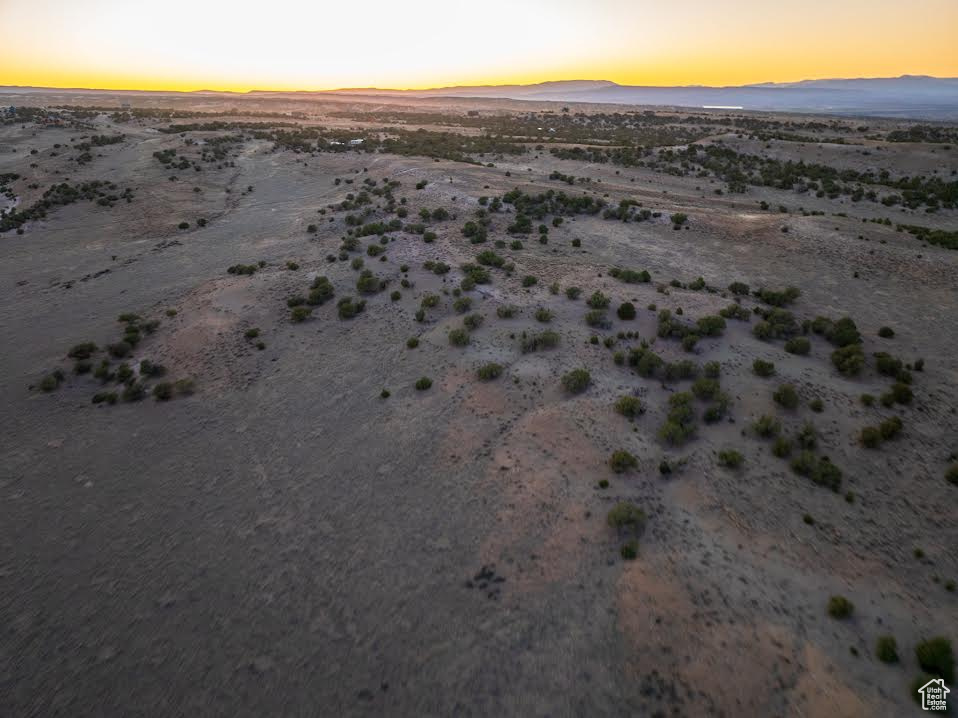 Drone / aerial view featuring view of desert, a mountain view, and a rural view