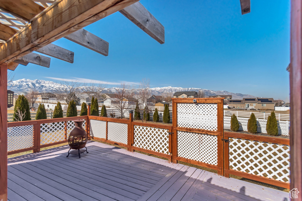 Deck featuring a residential view and a mountain view