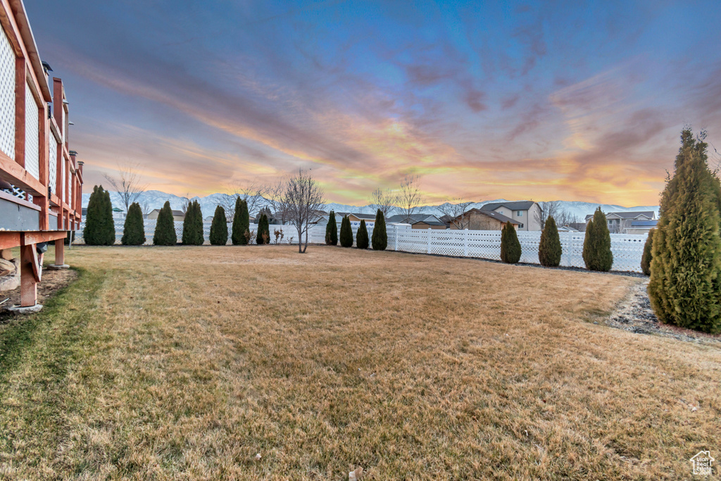 Yard at dusk with fence