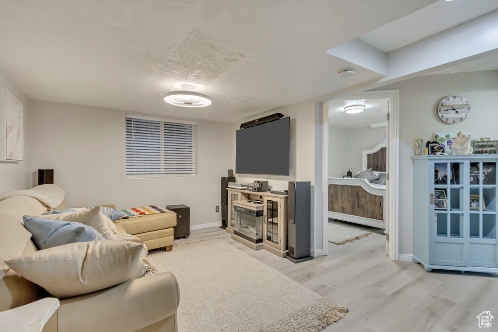 Living room featuring light wood finished floors and baseboards