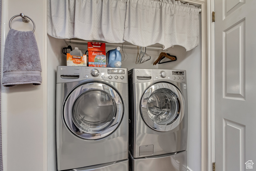 Laundry area featuring laundry area and washer and clothes dryer