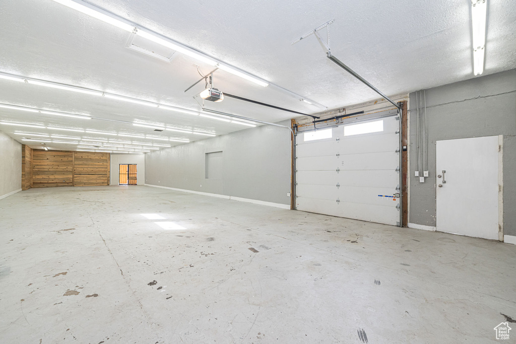 Garage featuring a garage door opener