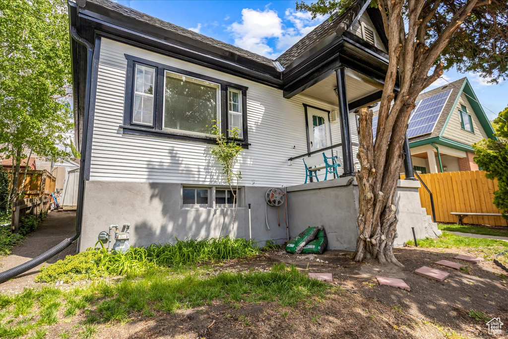 Rear view of house featuring fence