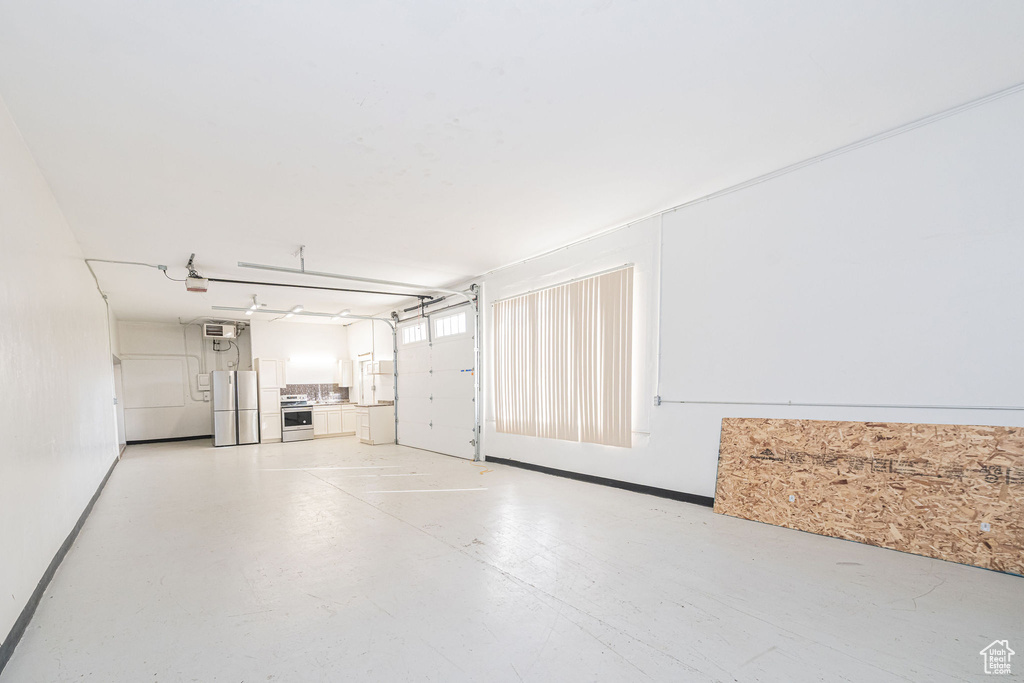 Garage with freestanding refrigerator