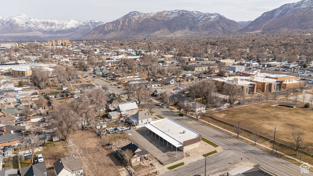 Drone / aerial view with a residential view and a mountain view