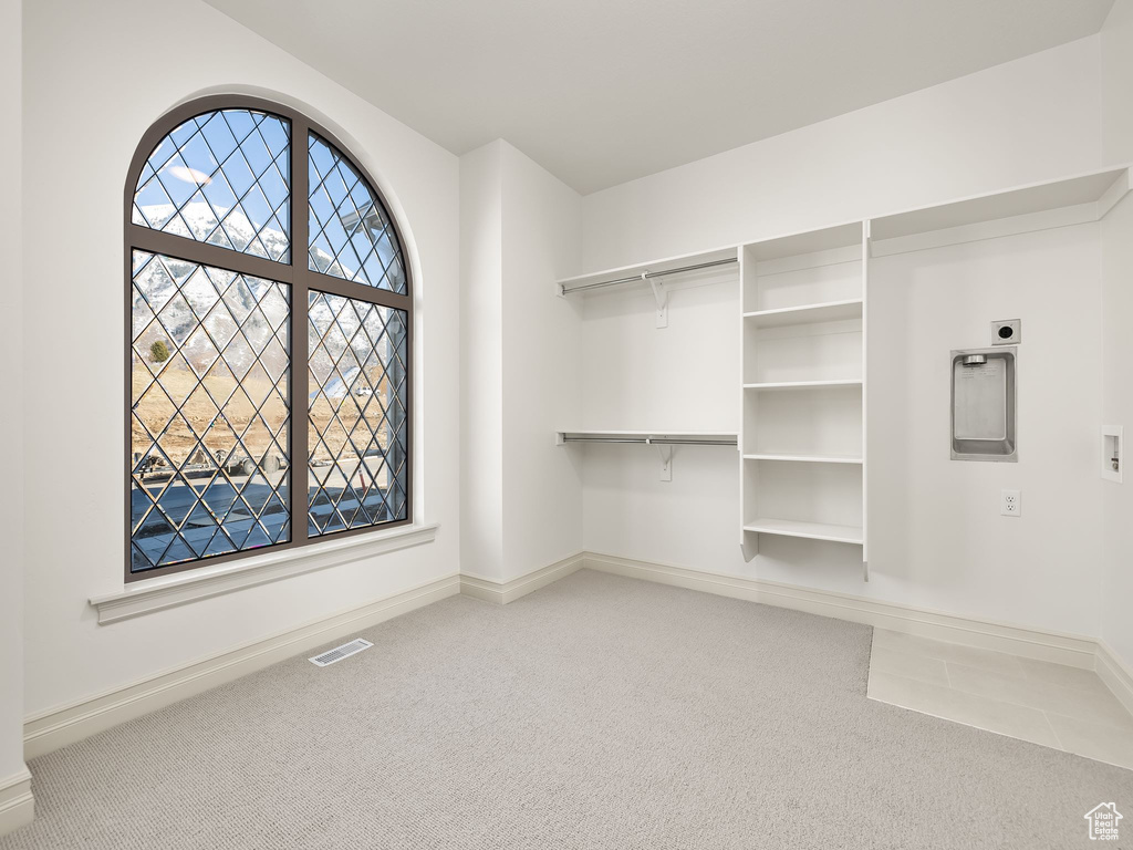 Spacious closet featuring visible vents and carpet flooring