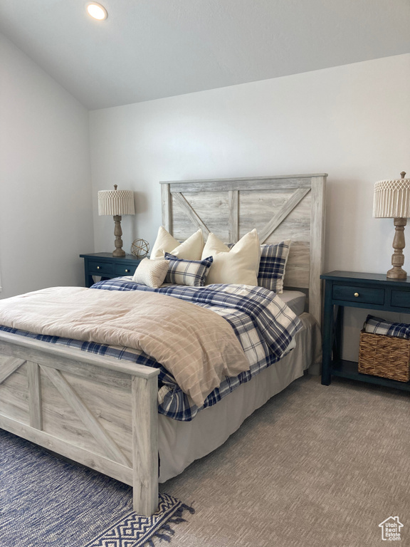 Carpeted bedroom with recessed lighting