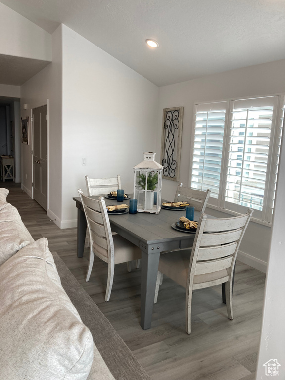 Dining space featuring recessed lighting, light wood-style flooring, and baseboards