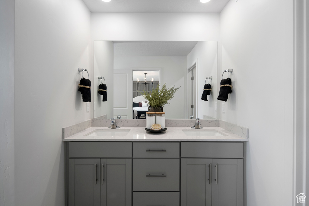 Bathroom featuring a sink and double vanity