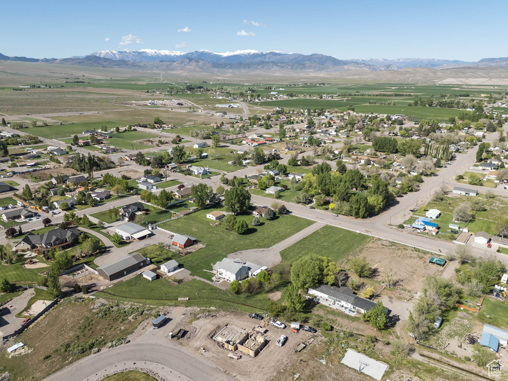 Aerial overview of property's location featuring a mountain backdrop
