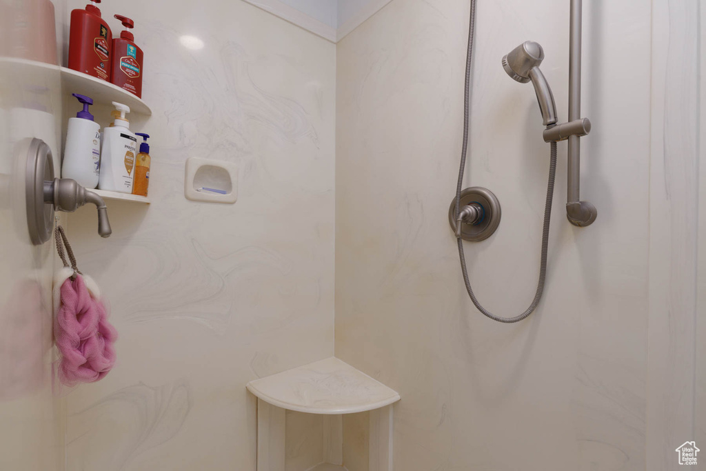 Bathroom with a marble finish shower