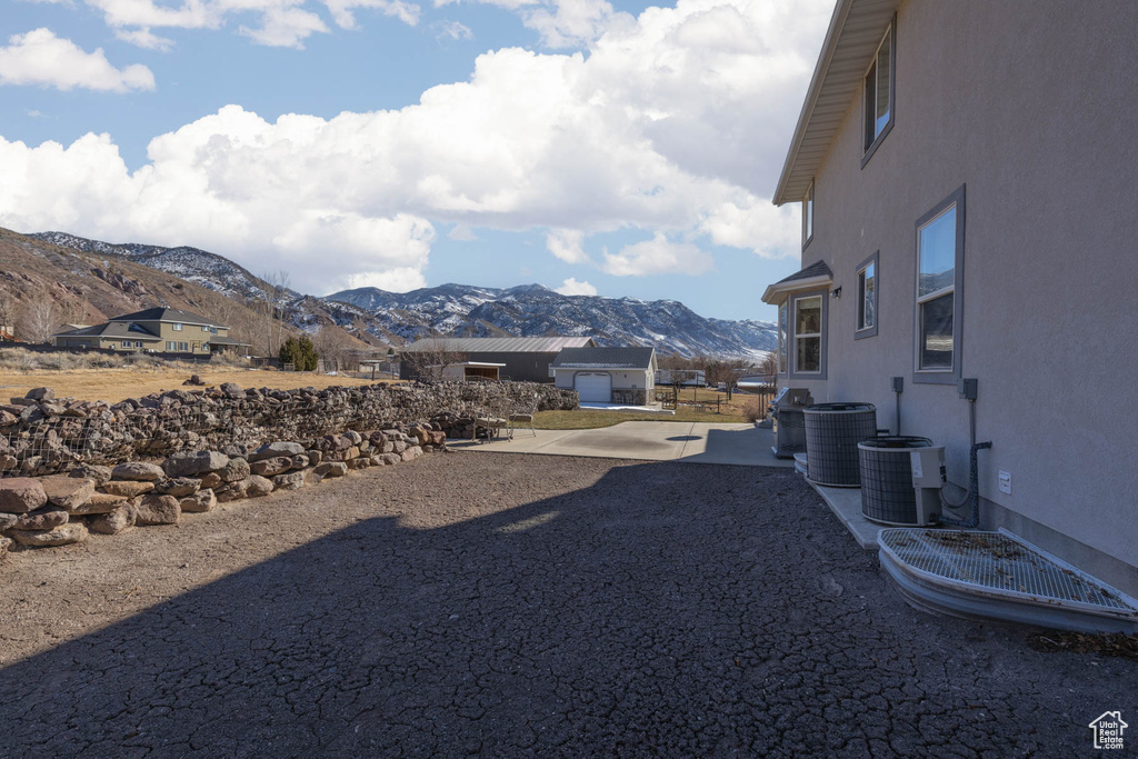 View of yard featuring a patio area and a mountain view