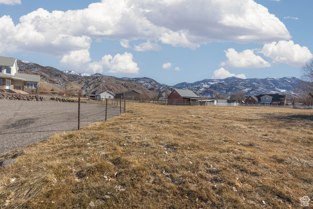 Property view of mountains with a rural view