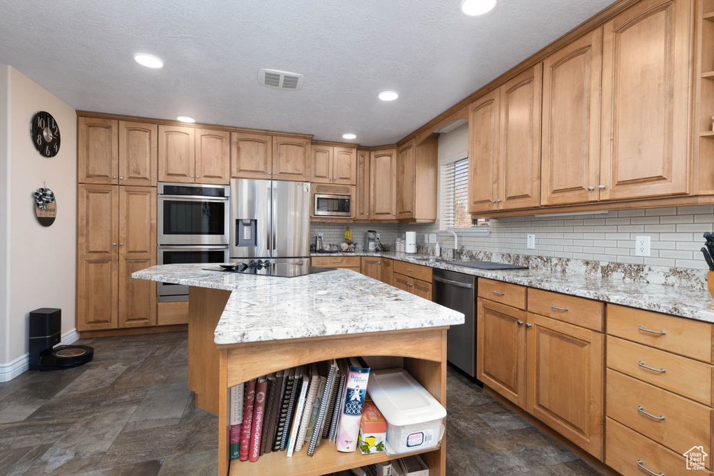 Kitchen featuring open shelves, visible vents, stainless steel appliances, and decorative backsplash