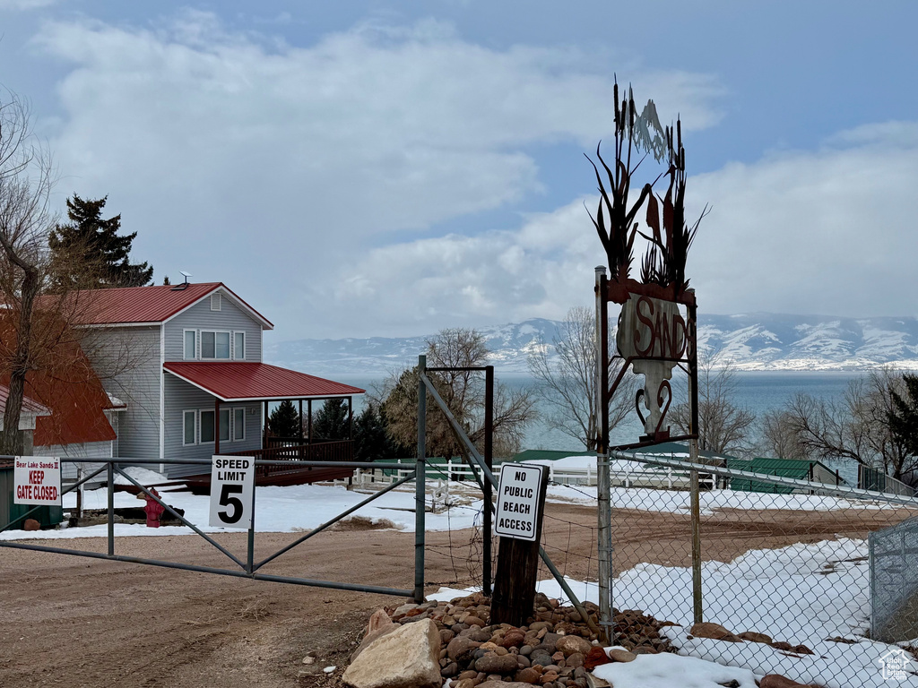 Exterior space featuring fence and a mountain view