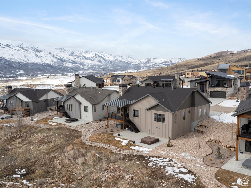 Drone / aerial view with a mountain view and a residential view