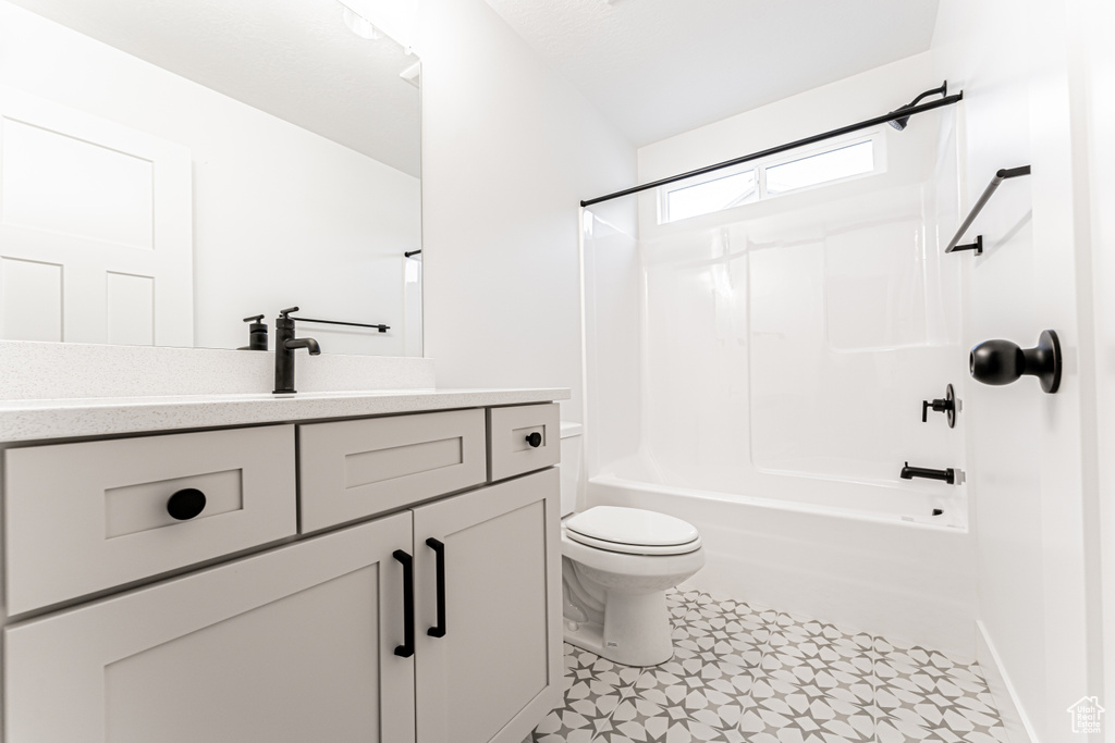 Bathroom with vanity and  shower combination