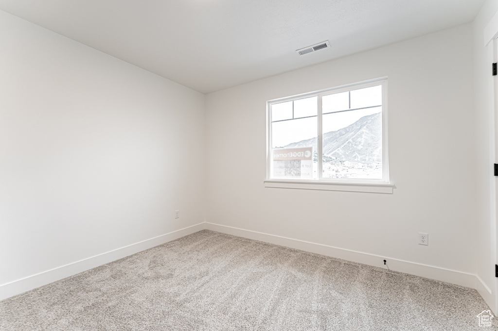 Spare room with carpet flooring and baseboards