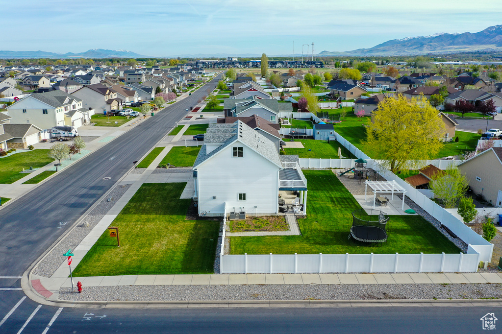 Birds eye view of property with a residential view and a mountain view
