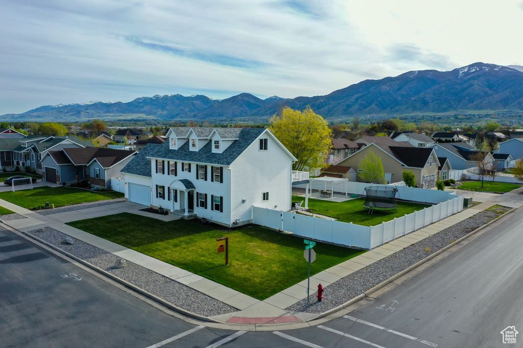 Exterior space featuring a residential view and a mountain view