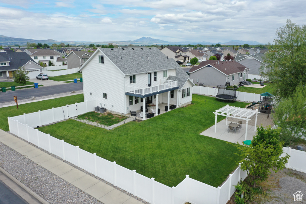 Aerial perspective of suburban area with a mountainous background