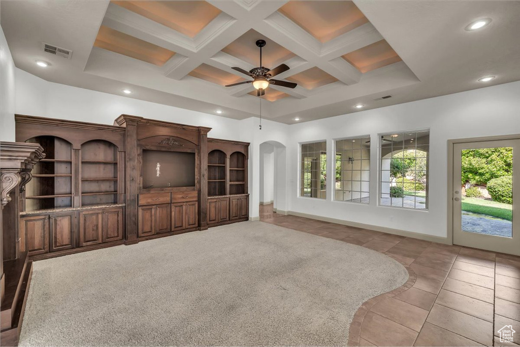 Unfurnished living room with coffered ceiling, a ceiling fan, light tile patterned floors, recessed lighting, and beam ceiling