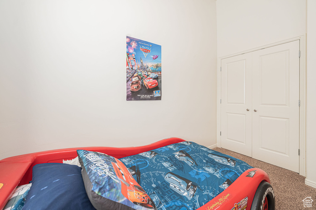 Bedroom with carpet and baseboards