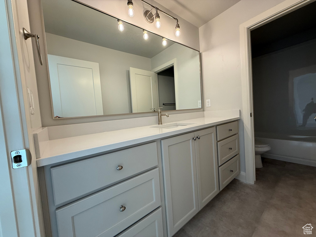 Bathroom featuring toilet and vanity