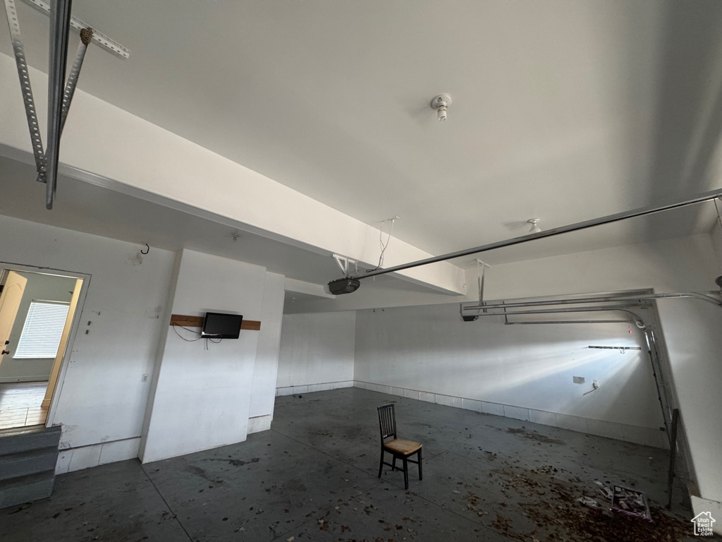 Garage featuring a garage door opener