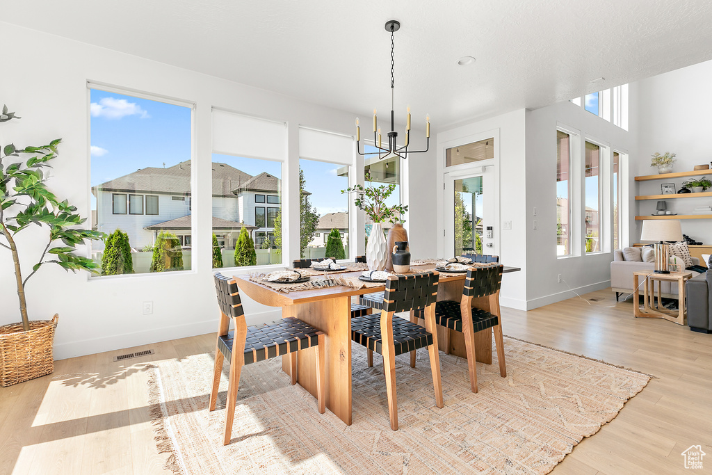 Dining room featuring a chandelier and light wood finished floors