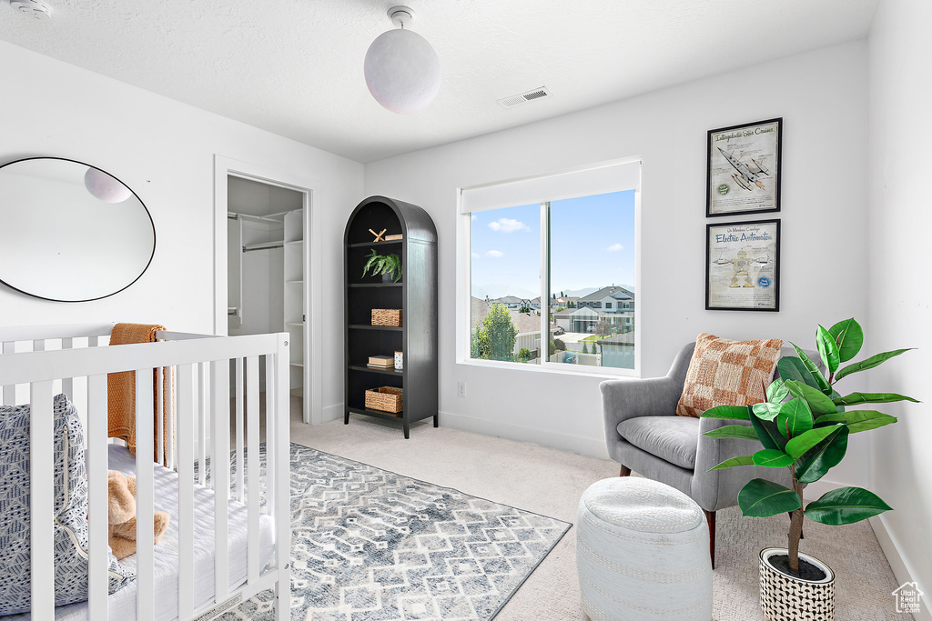Carpeted bedroom featuring baseboards