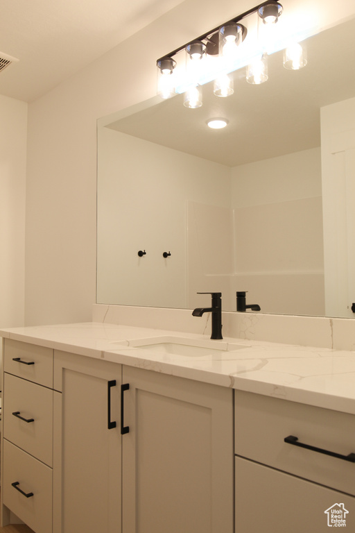 Bathroom with visible vents and vanity