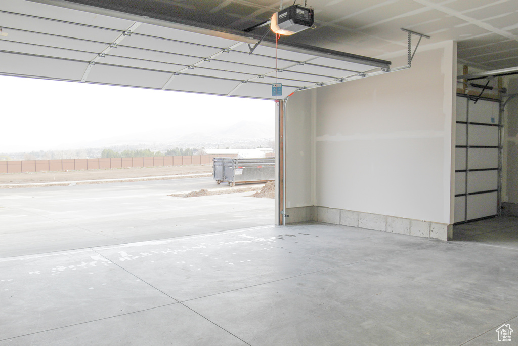 Garage featuring a garage door opener