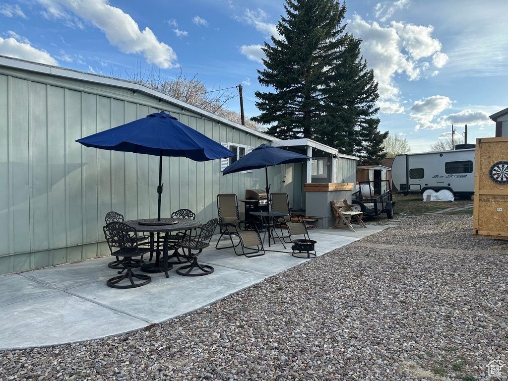 View of patio / terrace with an outdoor structure and a storage unit