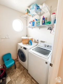 Laundry area featuring laundry area and washing machine and clothes dryer