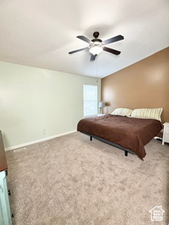 Carpeted bedroom featuring baseboards and a ceiling fan