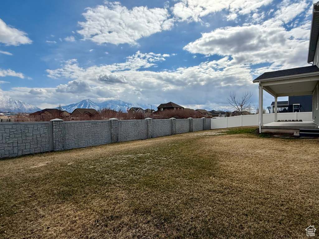 View of yard featuring fence