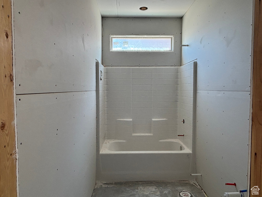 Full bath featuring a bath