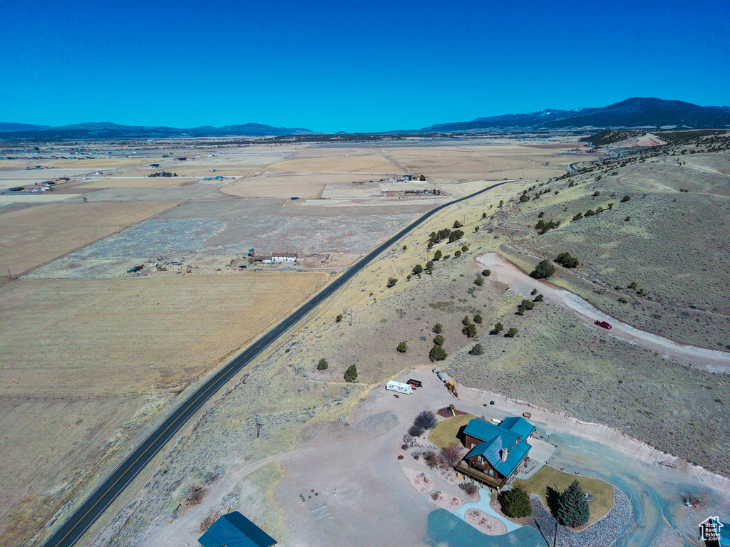 Birds eye view of property with a mountain view
