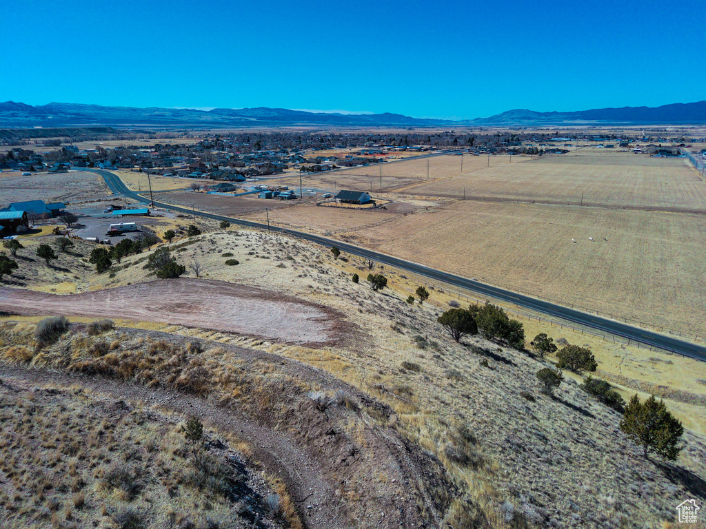 Birds eye view of property featuring a mountain view and a rural view