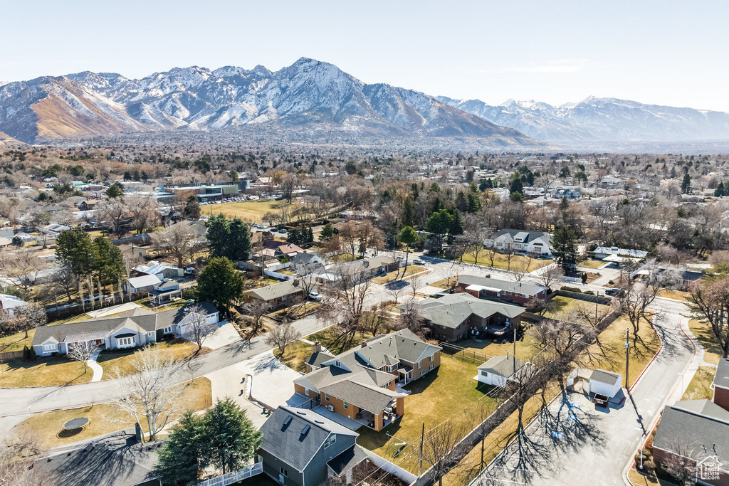 Aerial perspective of suburban area with a mountainous background