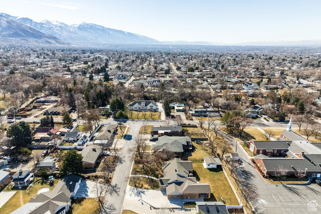 View of property location featuring nearby suburban area and a mountainous background