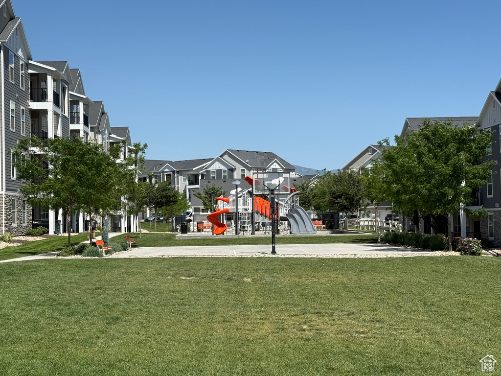 View of community with a residential view and a yard