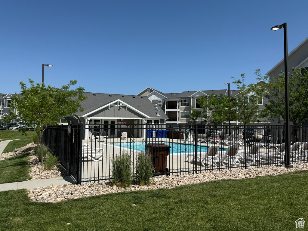 Community pool featuring a residential view and a patio area