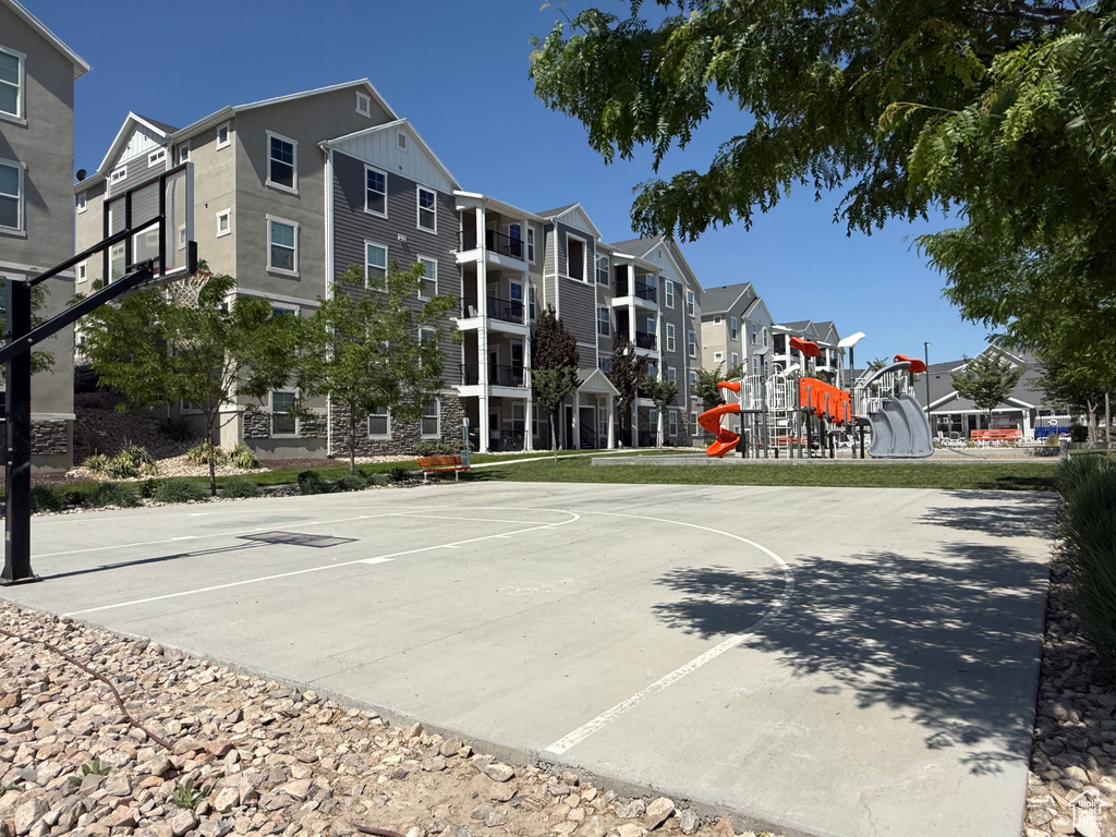 View of basketball court featuring community basketball court and a residential view