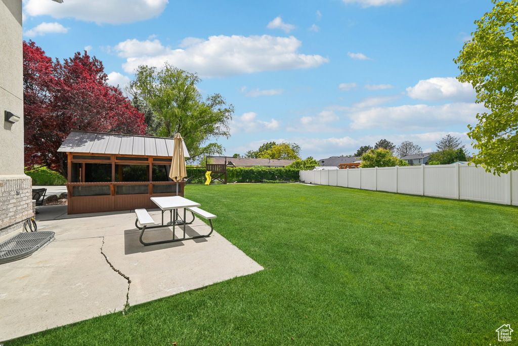 View of yard with a patio area
