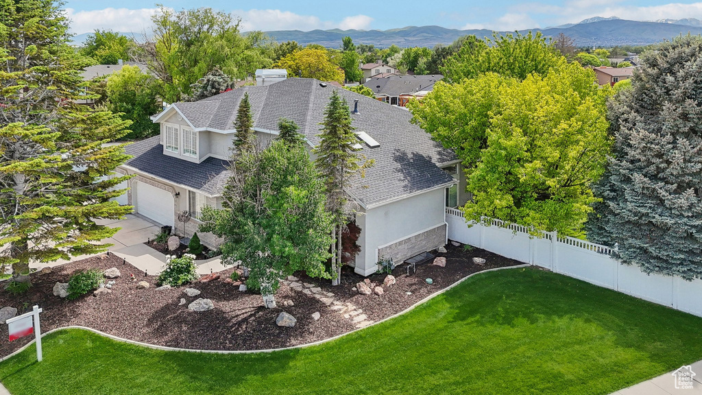 View from above of property with a mountain backdrop