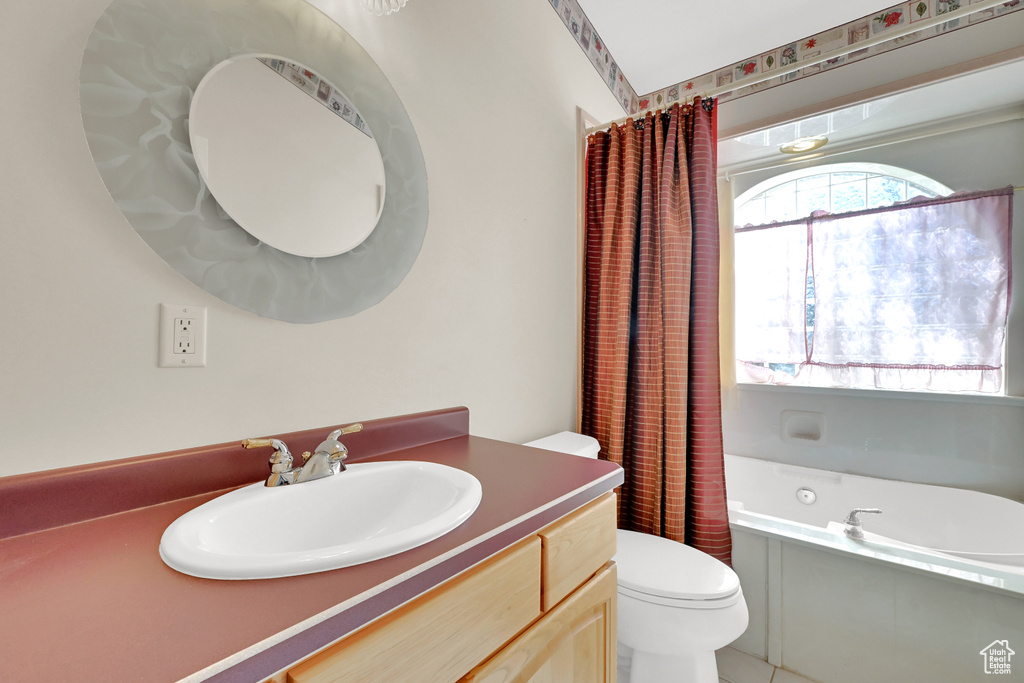 Full bath with vanity and toilet